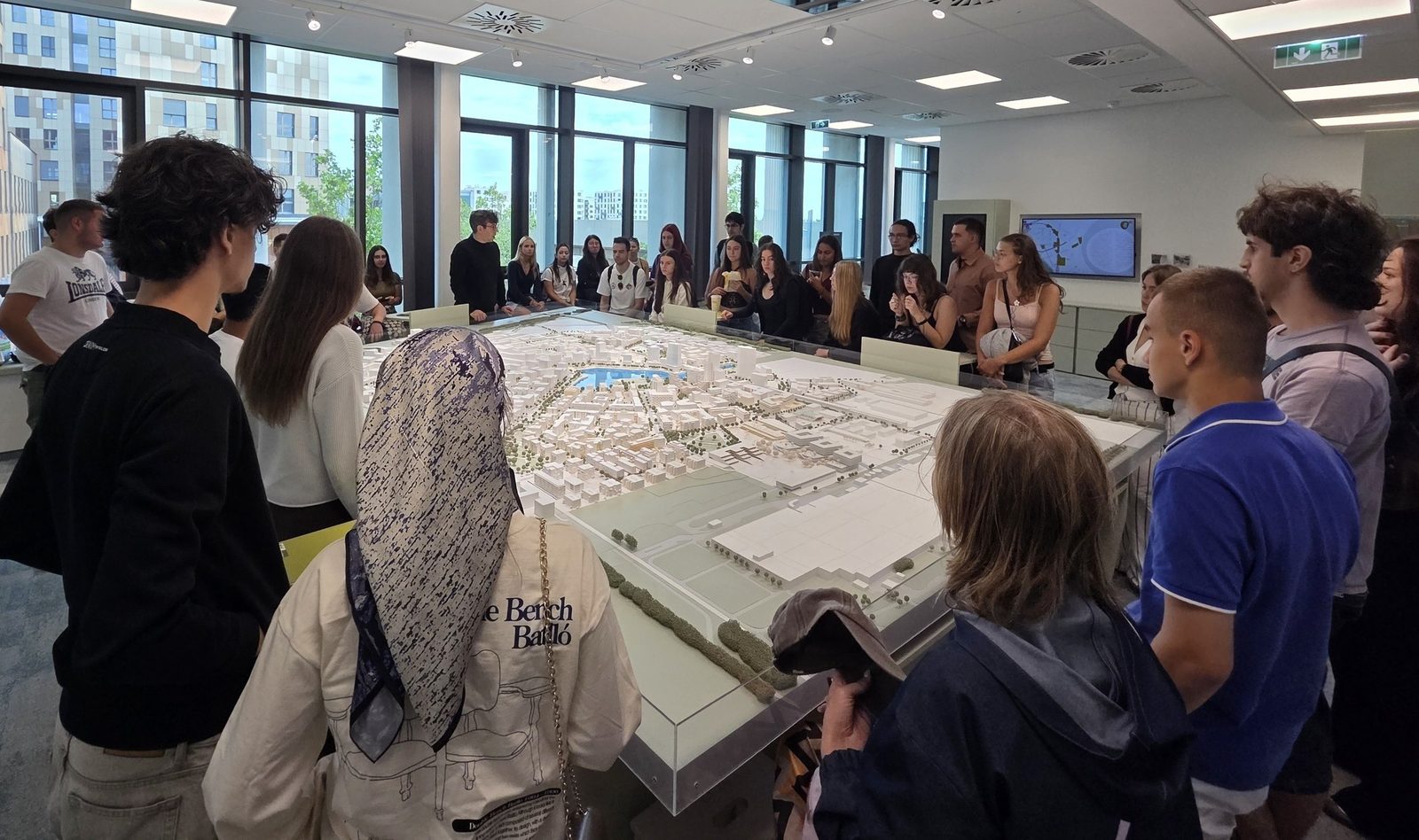 Participants at the city model of Seestadt Aspern during the youth exchange Nurturing Earth and Wellbeing